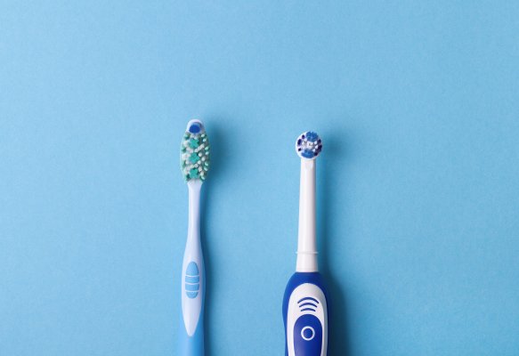 Two toothbrushes beside each other 